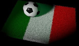 Un pallone da calcio su un prato colorato con le cromature della bandiera italiana